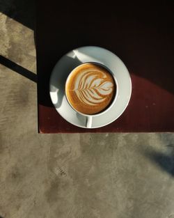 High angle view of cappuccino on table