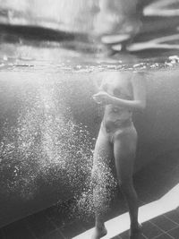 High angle view of man swimming in pool