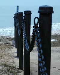 Metal railing by sea