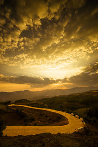 Scenic view of landscape against sky during sunset