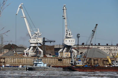 The river port. special equipment and water transport in the port. port crane, sand mining. 