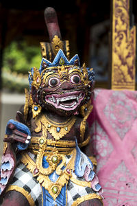 Close-up of statue against temple