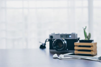 Close-up of camera on table