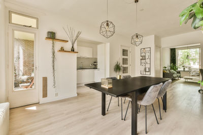 Empty chairs and tables and table and lounge chair on floor at home