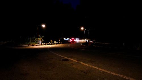 Illuminated road at night