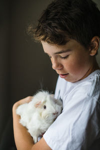 Teen boy with his pet guinea pig