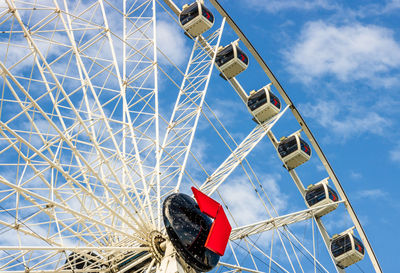 Low angle view of ferris wheel against sky