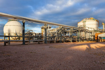 View of a gas refinery plant at sunset.