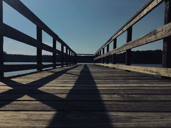 View of footbridge against clear sky