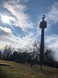 Low angle view of tower against cloudy sky