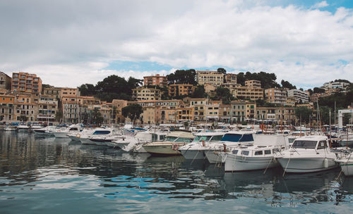 Boats moored at harbor