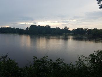 Scenic view of lake against sky during sunset