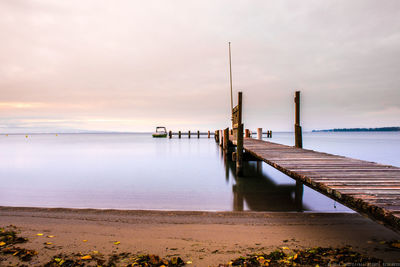 Scenic view of sea against sky at sunset