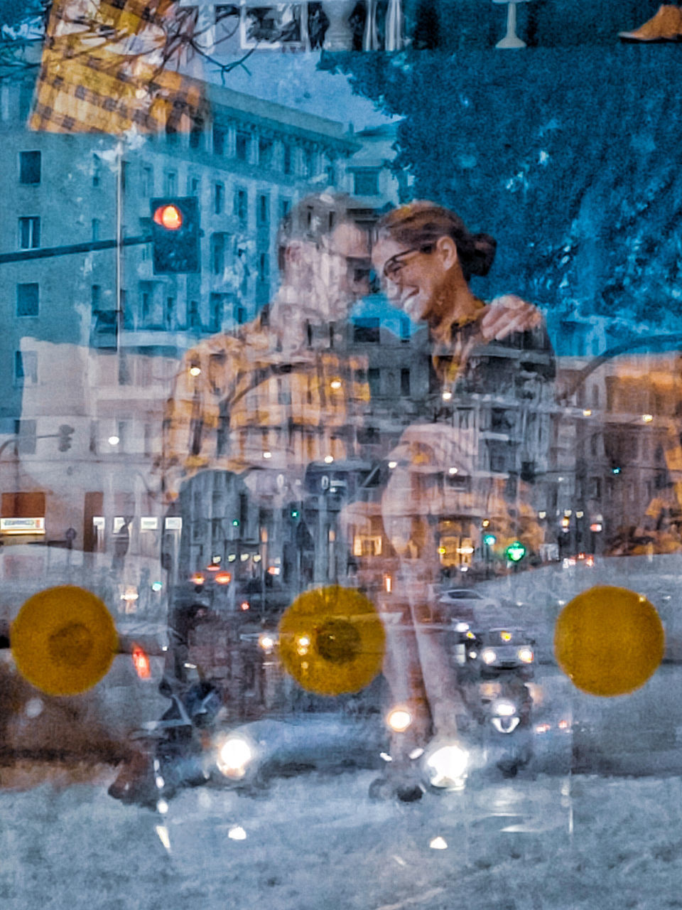 DIGITAL COMPOSITE IMAGE OF WOMAN WITH REFLECTION ON GLASS WINDOW IN CITY
