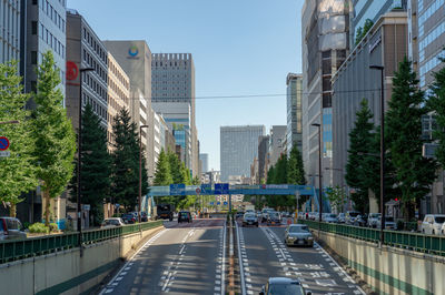 City street and buildings against sky