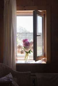 Flower vase on window sill