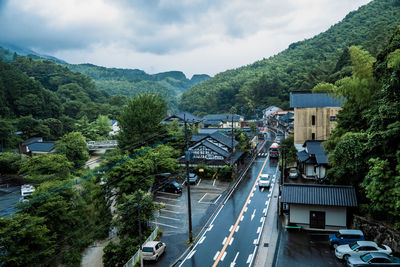 High angle view of cars on road against sky on a rainy day in fukuoka, japan