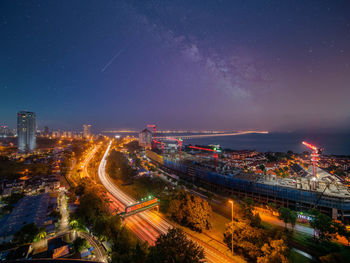 High angle view of illuminated cityscape at night