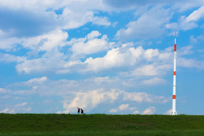 People on field against sky