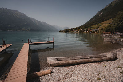 Scenic view of sea and mountains against sky