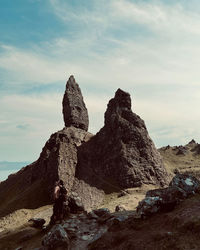 Rock formations on land against sky