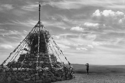 Low angle view of traditional windmill against sky