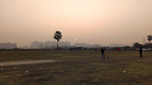 Scenic view of field against sky during sunset
