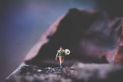 Close-up of woman standing on rock