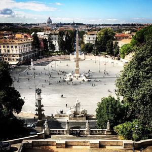 High angle view of city against cloudy sky