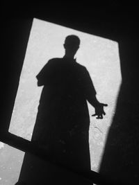 Shadow of silhouette man on floor