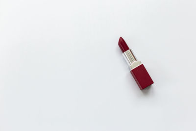 High angle view of red umbrella against white background