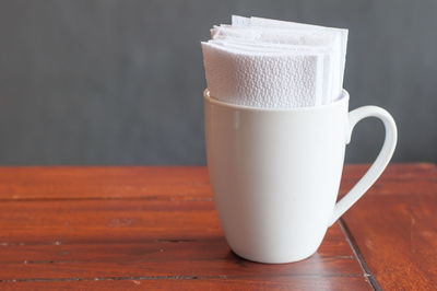 Close-up of coffee cup on table