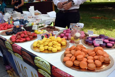 Various macarons for sale at market stall