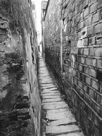 Narrow street leading towards building