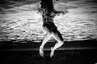 Young woman swimming in water