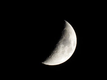 Low angle view of moon against clear sky at night