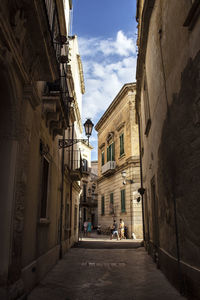 Narrow alley amidst buildings in town