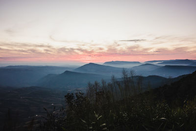 Scenic view of mountains against sky during sunset