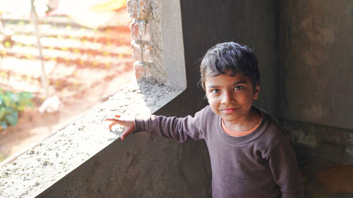 Cute and innocent asian boy looking at camera and smiling. asian people life style concept.