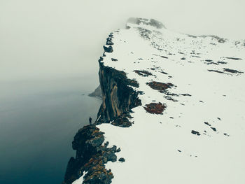 Scenic view of sea against sky during winter