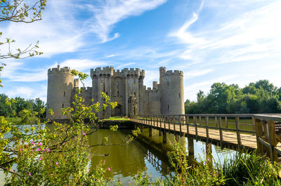 Bridge over a moat and the 14th century bodiam castle, east sussex, england