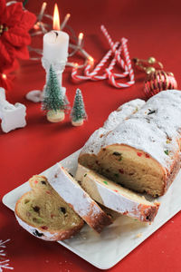 Christmas stollen on rustic background. traditional christmas festive pastry dessert from german. 