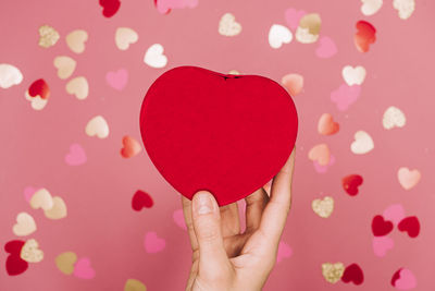 Close-up of woman hand holding heart shape