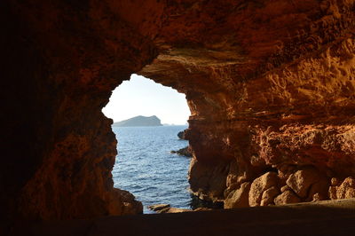 View of sea through cave