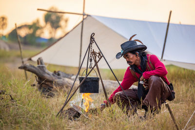 Rear view of man working on field