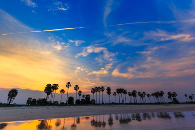 Scenic view of beach against sky during sunset