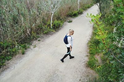 High angle view of boy running on grass