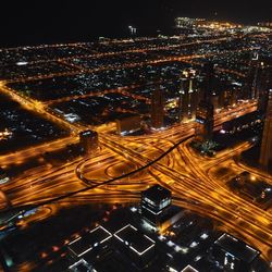 Aerial view of illuminated cityscape at night