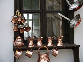 Close-up of kitchen utensils on shelf