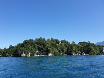 Scenic view of sea against clear blue sky